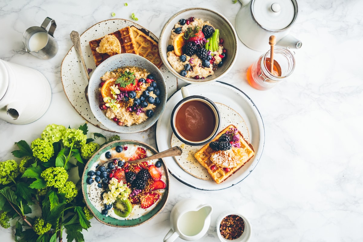 Shared meal on a table with bowls and dishes