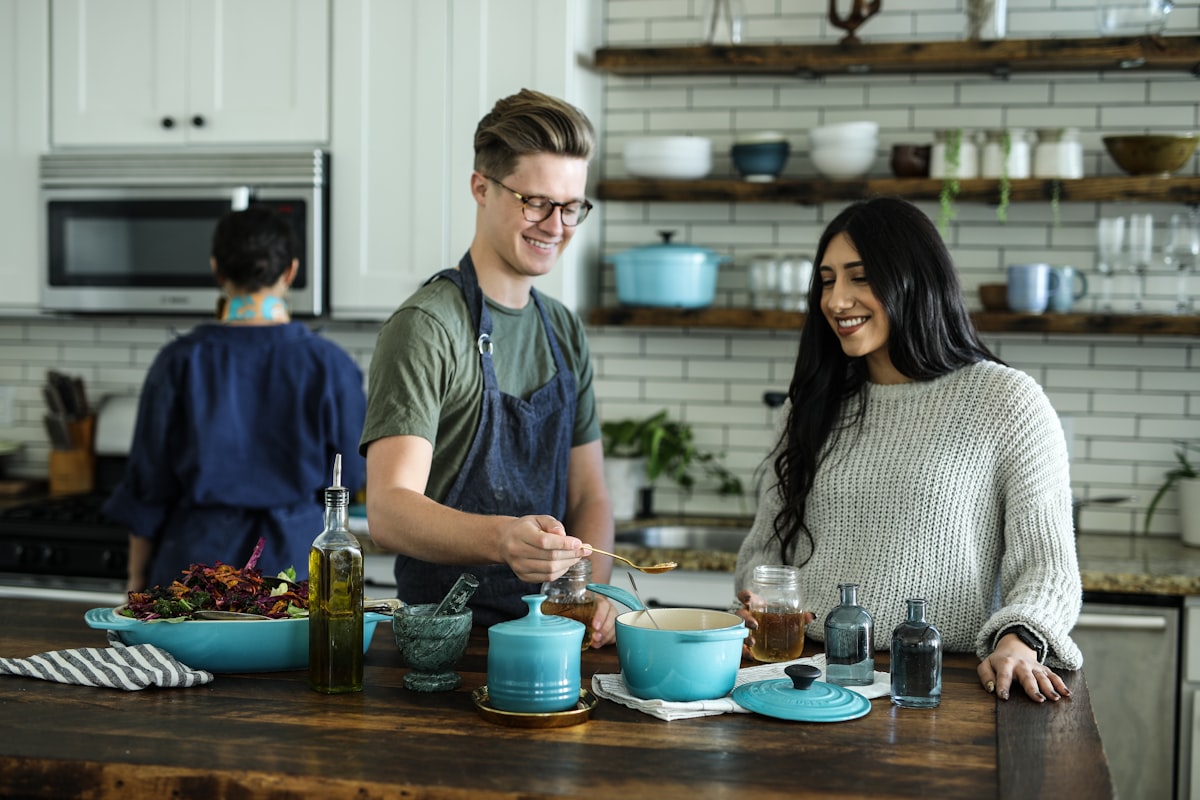Warm kitchen scene with ingredients and prep on a wooden counter